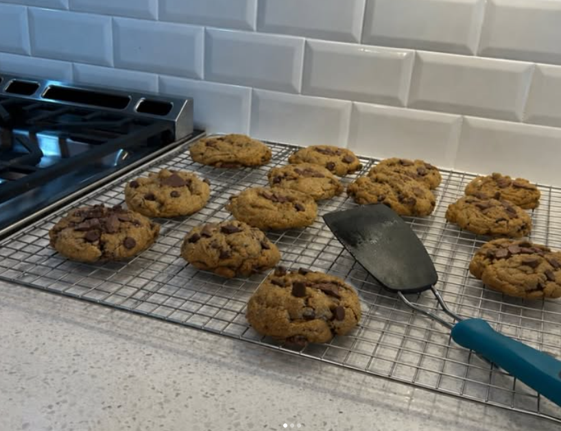 Fresh cookies on a cooling rack beside the stove